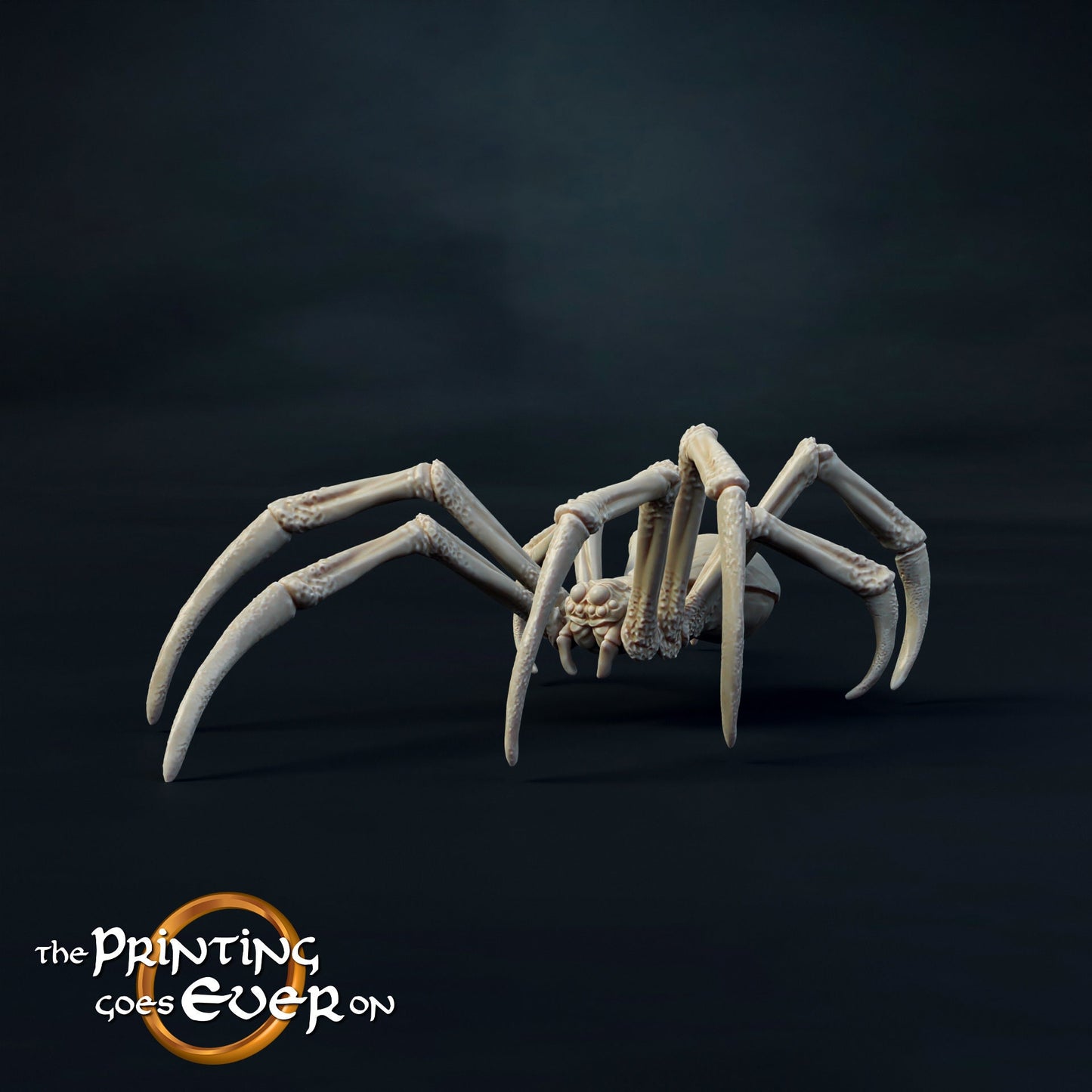 a fake spider sitting on top of a black surface