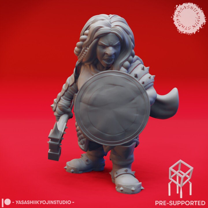 a statue of a man holding a shield