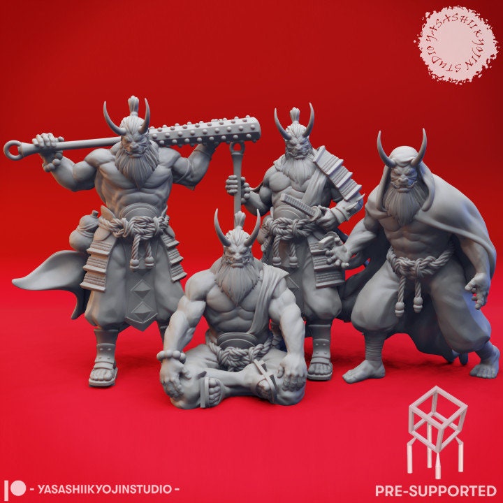 a group of three figurines sitting next to each other